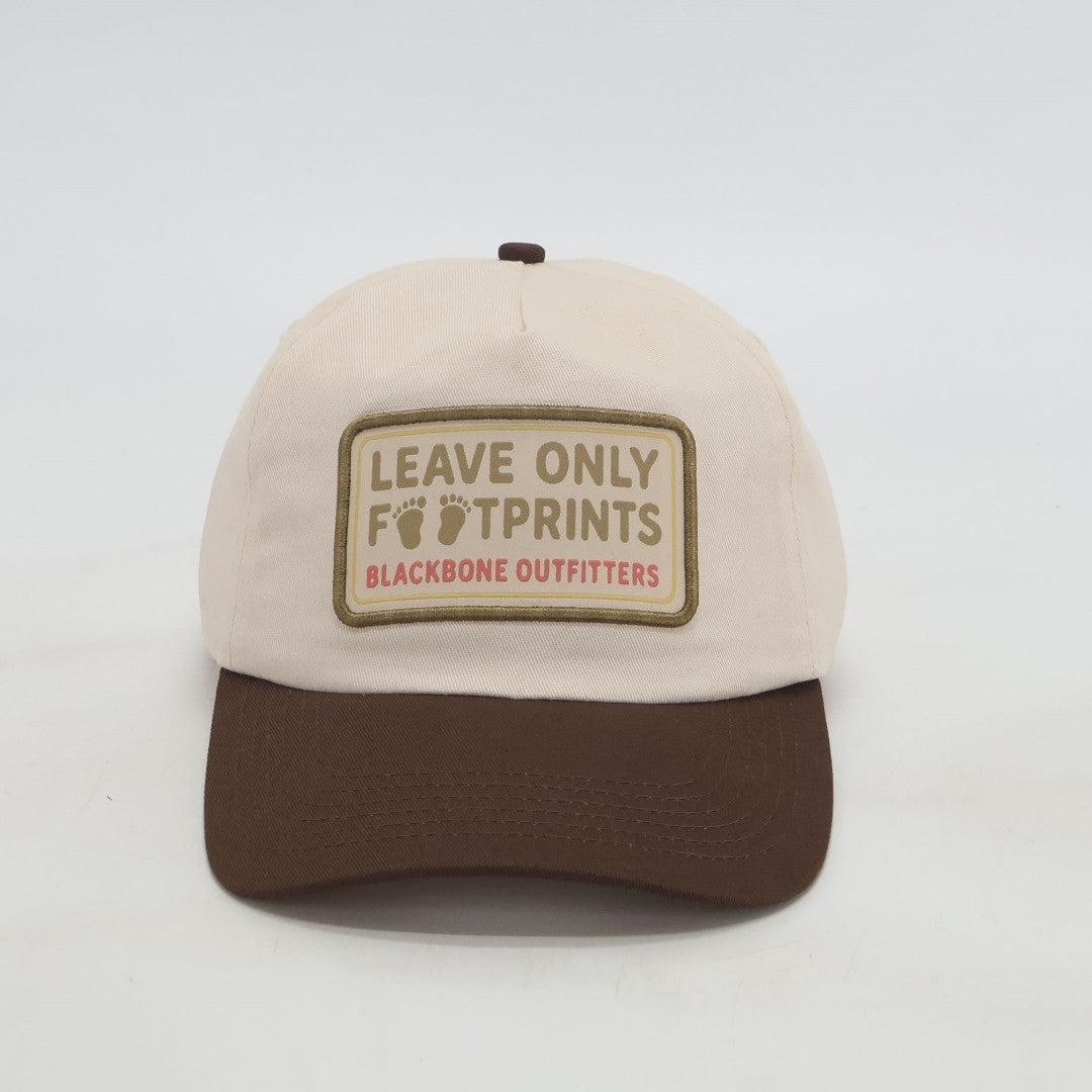 Black FootPrints Snapback hat with embroidered logo, showcasing a classic flat brim design and adjustable strap.